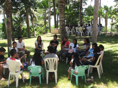 Small group meetings at campsite.